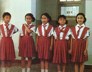 
Young volunteers serve one-half day a week as the greeters at the "Children’s Railroad," a park in the People’s Republic of China.
